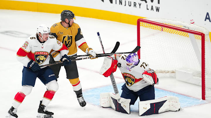 Nov 10, 2025; Las Vegas, Nevada, USA; Florida Panthers goaltender Sergei Bobrovsky (72) makes a save against Vegas Golden Knights left wing Ivan Barbashev (49) as Florida Panthers defenseman Donovan Sebrango (6) lifts his stick during the third period at T-Mobile Arena. Mandatory Credit: Stephen R. Sylvanie-Imagn Images