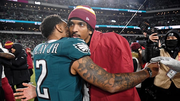 Jan 26, 2025; Philadelphia, PA, USA; Philadelphia Eagles cornerback Darius Slay Jr. (2) hugs Washington Commanders quarterback Jayden Daniels (5) after the NFC Championship game at Lincoln Financial Field. Mandatory Credit: Eric Hartline-Imagn Images