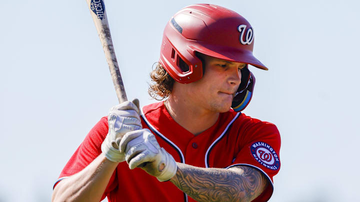Feb 20, 2023; West Palm Beach, FL, USA; Washington Nationals infielder Brady House (9) practices his swing during a spring training workout at The Ballpark of the Palm Beaches. Sam Navarro-Imagn Images