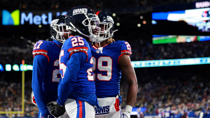 Dec 11, 2023; East Rutherford, New Jersey, USA; New York Giants cornerback Deonte Banks (25) celebrates after a play during the fourth quarter against the Green Bay Packers at MetLife Stadium. Mandatory Credit: Vincent Carchietta-USA TODAY Sports