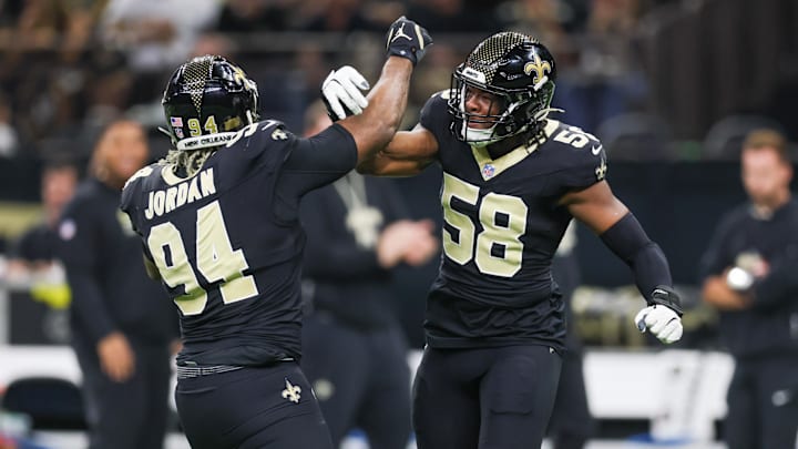 Nov 23, 2025; New Orleans, Louisiana, USA; New Orleans Saints defensive end Cameron Jordan (94) and defensive end Chris Rumph II (58) react after a defensive play against the Atlanta Falcons during the first half at Caesars Superdome. Mandatory Credit: Stephen Lew-Imagn Images