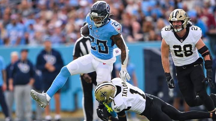 Dec 28, 2025; Nashville, Tennessee, USA; Tennessee Titans running back Tony Pollard (20) hurdles over New Orleans Saints cornerback Alontae Taylor (1) during the first half at Nissan Stadium. Mandatory Credit: Steve Roberts-Imagn Images Dec 28, 2025; Nashville, Tennessee, USA; Tennessee Titans running back Tony Pollard (20) hurdles over New Orleans Saints cornerback Alontae Taylor (1) during the first half at Nissan Stadium. Mandatory Credit: Steve Roberts-Imagn Images