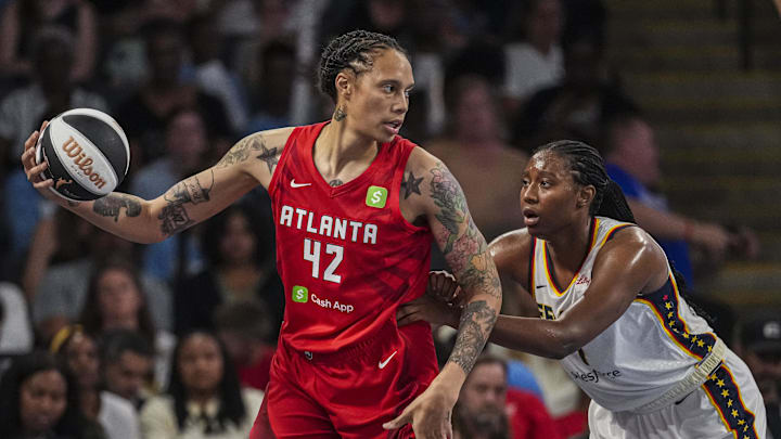 Jun 10, 2025; College Park, Georgia, USA; Atlanta Dream center Brittney Griner (42) is guarded by Indiana Fever forward Aliyah Boston (7) at Gateway Center Arena at College Park. Mandatory Credit: Dale Zanine-Imagn Images