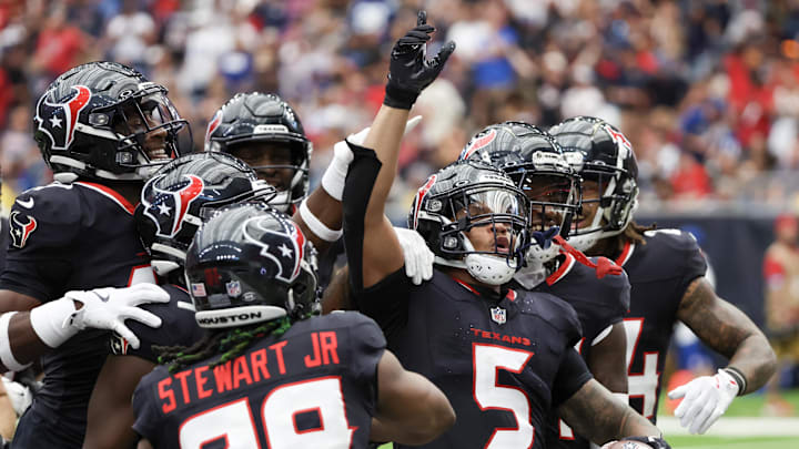 Oct 27, 2024; Houston, Texas, USA; Houston Texans safety Jalen Pitre (5) celebrates his interception with teammates against the Indianapolis Colts  in the second quarter at NRG Stadium. Mandatory Credit: Thomas Shea-Imagn Images