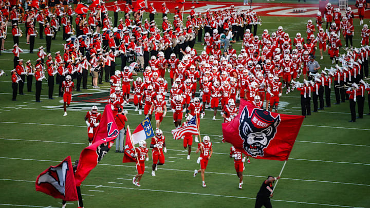 Aug 28, 2025; Raleigh, North Carolina, USA; North Carolina State Wolfpack runs out during the first half of the game against East Carolina Pirates at Carter-Finley Stadium. Mandatory Credit: Jaylynn Nash-Imagn Images Aug 28, 2025; Raleigh, North Carolina, USA; North Carolina State Wolfpack runs out during the first half of the game against East Carolina Pirates at Carter-Finley Stadium. Mandatory Credit: Jaylynn Nash-Imagn Images