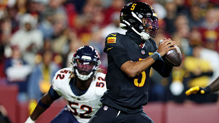 Darrell Taylor closes in as Jayden Daniels gets off a pass in the Hail Mary game earlier this season.