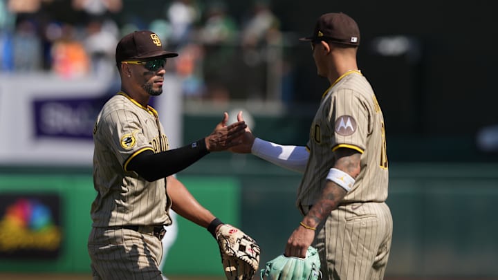 Apr 9, 2025; West Sacramento, California, USA; San Diego Padres shortstop Xander Bogaerts (left) and third baseman Manny Machado (right) celebrate after defeating the Athletics at Sutter Health Park. Mandatory Credit: Darren Yamashita-Imagn Images