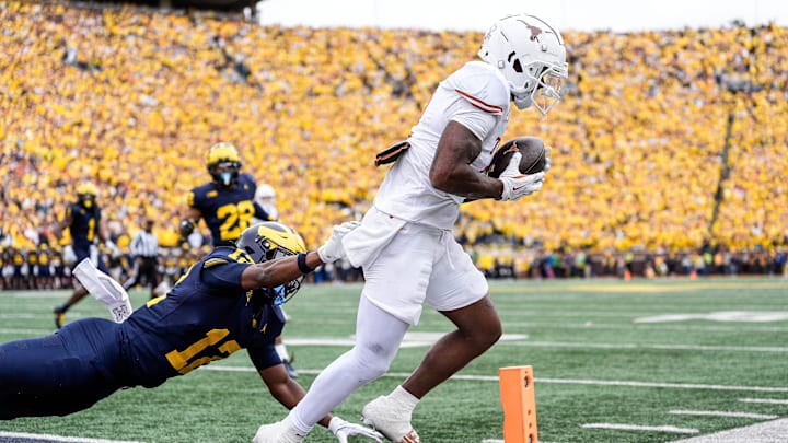 Texas wide receiver Matthew Golden (2) scores a touchdown against Michigan defensive back Aamir Hall.