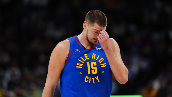 Nov 2, 2024; Denver, Colorado, USA; Denver Nuggets center Nikola Jokic (15) reacts to a turnover the first quarter against the Utah Jazz at Ball Arena. 