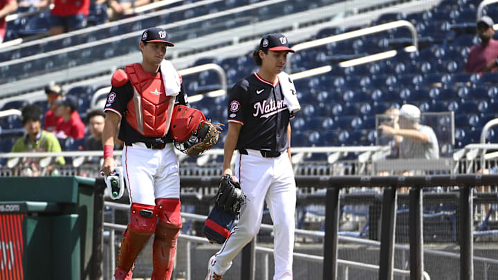 Sep 1, 2025; Washington, District of Columbia, USA; Washington Nationals catcher CJ Stubbs (left) and starting pitcher Andrew Alvarez (54) walk to the dugout before the game against the Miami Marlins at Nationals Park. 