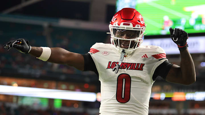 Oct 17, 2025; Miami Gardens, Florida, USA; Louisville Cardinals wide receiver Chris Bell (0) celebrates after scoring a touchdown against the Miami Hurricanes during the first quarter at Hard Rock Stadium. Mandatory Credit: Sam Navarro-Imagn Images