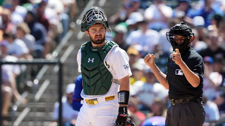 Apr 13, 2025; West Sacramento, California, USA; Athletics catcher Shea Langeliers (center) during the first inning against the New York Mets at Sutter Health Park. Mandatory Credit: Darren Yamashita-Imagn Images