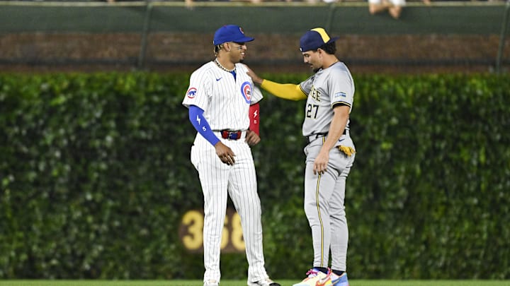 Jul 23, 2024; Chicago, Illinois, USA;  Chicago Cubs third base Christopher Morel (5) and Milwaukee Brewers shortstop Willy Adames (27) talk before the game at Wrigley Field.