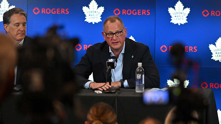 Jun 1, 2023; Toronto, Ontario, CANADA; Toronto Maple Leafs new general manager Brad Treliving is introduced by club president Brendan Shanahan (left) at a press conference at Scotiabank Arena. Mandatory Credit: Dan Hamilton-Imagn Images