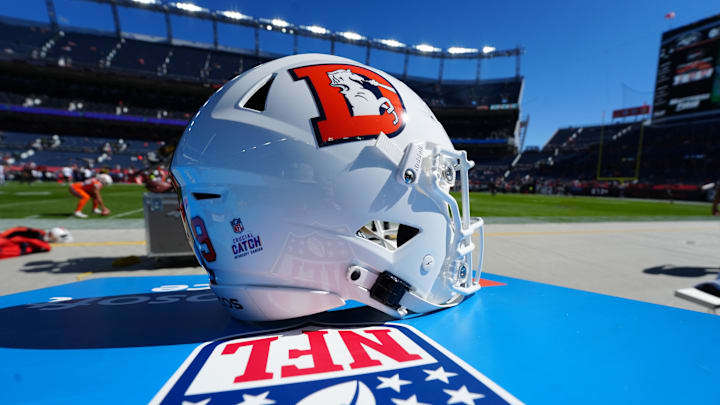 Oct 8, 2023; Denver, Colorado, USA; Detailed view of a White Cap edition Denver Broncos helmet worn by Denver Broncos punter Riley Dixon (9) before game against the New York Jets at Empower Field at Mile High. Mandatory Credit: Ron Chenoy-Imagn Images Oct 8, 2023; Denver, Colorado, USA; Detailed view of a White Cap edition Denver Broncos helmet worn by Denver Broncos punter Riley Dixon (9) before game against the New York Jets at Empower Field at Mile High. Mandatory Credit: Ron Chenoy-Imagn Images