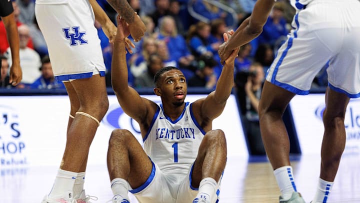 Nov 26, 2024; Lexington, Kentucky, USA; Kentucky Wildcats guard Lamont Butler (1) is helped to his feet during the second half against the Western Kentucky Hilltoppers at Rupp Arena at Central Bank Center. Mandatory Credit: Jordan Prather-Imagn Images Nov 26, 2024; Lexington, Kentucky, USA; Kentucky Wildcats guard Lamont Butler (1) is helped to his feet during the second half against the Western Kentucky Hilltoppers at Rupp Arena at Central Bank Center. Mandatory Credit: Jordan Prather-Imagn Images