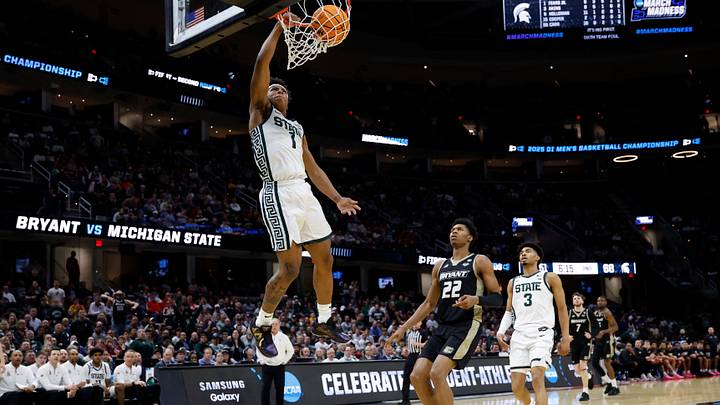 Mar 21, 2025; Cleveland, OH, USA; Michigan State Spartans guard Jeremy Fears Jr. (1) dunks the ball in the second half against the Bryant University Bulldogs during the NCAA Tournament First Round at Rocket Mortgage Fieldhouse. Mandatory Credit: Rick Osentoski-Imagn Images Mar 21, 2025; Cleveland, OH, USA; Michigan State Spartans guard Jeremy Fears Jr. (1) dunks the ball in the second half against the Bryant University Bulldogs during the NCAA Tournament First Round at Rocket Mortgage Fieldhouse. Mandatory Credit: Rick Osentoski-Imagn Images