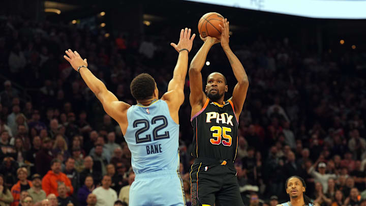 Feb 11, 2025; Phoenix, Arizona, USA; Phoenix Suns forward Kevin Durant (35) shoots over Memphis Grizzlies guard Desmond Bane (22) during the first half at Footprint Center. Mandatory Credit: Joe Camporeale-Imagn Images