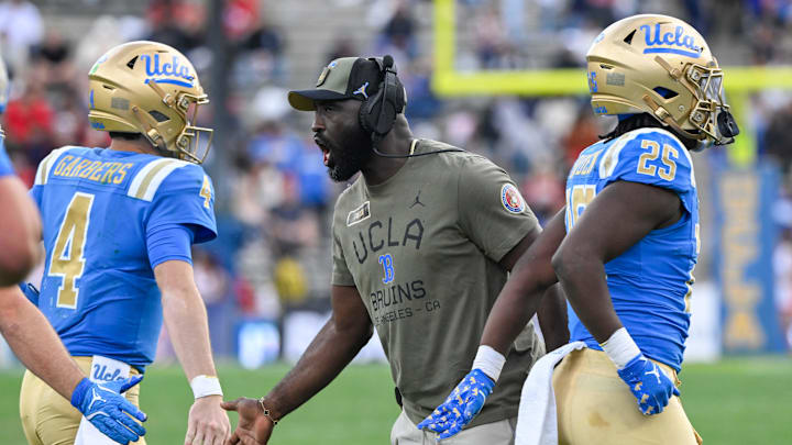 Nov 30, 2024; Pasadena, California, USA; UCLA Bruins head coach DeShaun Foster greets quarterback Ethan Garbers (4) during the third quarter against the Fresno State Bulldogs at Rose Bowl. Mandatory Credit: Robert Hanashiro-Imagn Images Nov 30, 2024; Pasadena, California, USA; UCLA Bruins head coach DeShaun Foster greets quarterback Ethan Garbers (4) during the third quarter against the Fresno State Bulldogs at Rose Bowl. Mandatory Credit: Robert Hanashiro-Imagn Images