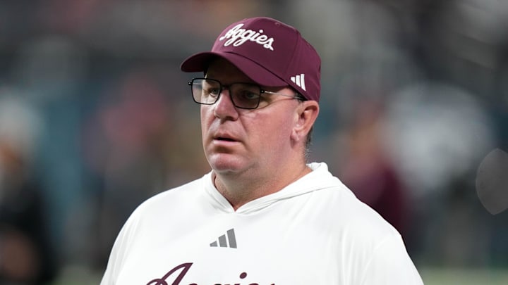 Dec 27, 2024; Las Vegas, NV, USA; Texas A&M Aggies head coach Mike Elko reacts against the Southern California Trojans in the first half at Allegiant Stadium. Mandatory Credit: Kirby Lee-Imagn Images
