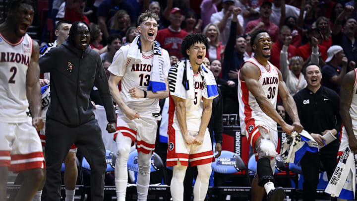 Mar 20, 2026; San Diego, CA, USA; Arizona Wildcats center Motiejus Krivas (13) and guard Brayden Burries (5) and forward Tobe Awaka (30) react with the bench in the second half against the LIU Sharks during a first round game of the men's 2026 NCAA Tournament at Viejas Arena. Mandatory Credit: Denis Poroy-Imagn Images Mar 20, 2026; San Diego, CA, USA; Arizona Wildcats center Motiejus Krivas (13) and guard Brayden Burries (5) and forward Tobe Awaka (30) react with the bench in the second half against the LIU Sharks during a first round game of the men's 2026 NCAA Tournament at Viejas Arena. Mandatory Credit: Denis Poroy-Imagn Images
