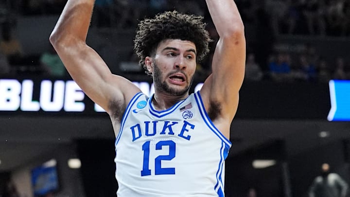 Mar 21, 2026; Greenville, SC, USA; Duke Blue Devils forward Cameron Boozer (12) scores a basket during the second half against the Texas Christian University Horned Frogs during a second round game of the men's 2026 NCAA Tournament at Bon Secours Wellness Arena. Mandatory Credit: Jim Dedmon-Imagn Images
