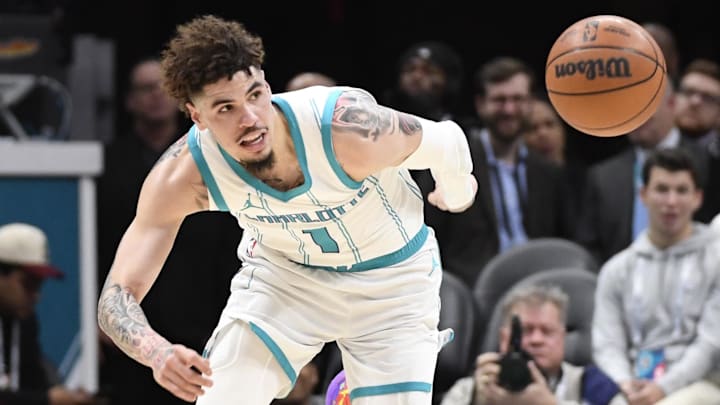 Jan 7, 2025; Charlotte, North Carolina, USA;  Charlotte Hornets guard LaMelo Ball (1) goes after a loose ball during the first half against the Phoenix Suns at the Spectrum Center. Mandatory Credit: Sam Sharpe-Imagn Images