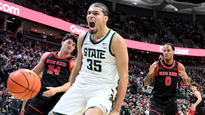 Dec 29, 2025; East Lansing, Michigan, USA;  Michigan State Spartans forward Jesse McCulloch (35) makes a loud dunk against the Cornell Big Red during the second half at Jack Breslin Student Events Center. Mandatory Credit: Dale Young-Imagn Images