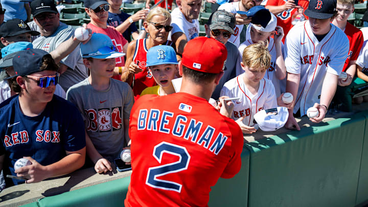 Boston Red Sox infielder Alex Bregman (2) signs autographs for fans before the start of their game against the Toronto Blue Jays at JetBlue Park at Fenway South on Feb. 23.