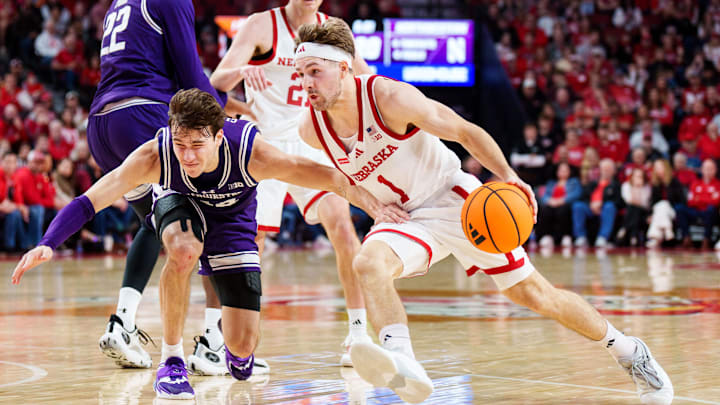 Feb 14, 2026; Lincoln, Nebraska, USA; Nebraska Cornhuskers guard Sam Hoiberg (1) drives against Northwestern Wildcats guard Angelo Ciaravino (44) during the first half at Pinnacle Bank Arena. Mandatory Credit: Dylan Widger-Imagn Images Feb 14, 2026; Lincoln, Nebraska, USA; Nebraska Cornhuskers guard Sam Hoiberg (1) drives against Northwestern Wildcats guard Angelo Ciaravino (44) during the first half at Pinnacle Bank Arena. Mandatory Credit: Dylan Widger-Imagn Images