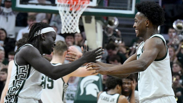 Feb 7, 2026; East Lansing, Michigan, USA;  Michigan State Spartans forward Cameron Ward (3) and Michigan State Spartans guard Kur Teng (2) celebrate in overtime against the Illinois Fighting Illini at Jack Breslin Student Events Center. Mandatory Credit: Dale Young-Imagn Images