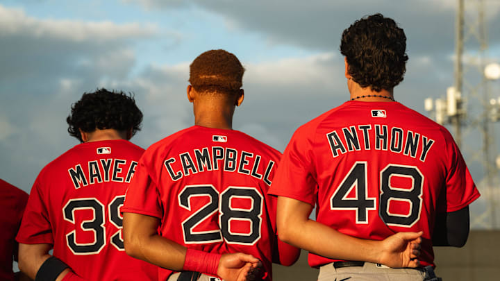 Boston's top-three prospects in Marcelo Mayer, Kristian Campbell and Roman Anthony stand for the national anthem ahead of a Spring Training breakout game on March 13, 2025.