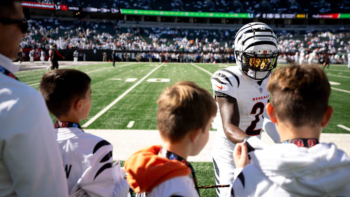 Cincinnati Bengals cornerback Mike Hilton (21) signs items for fans before the NFL game against the Philadelphia Eagles at Paycor Stadium in Cincinnati on Sunday, Oct. 27, 2024.