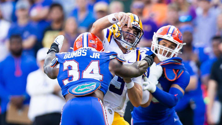 Florida Gators edge George Gumbs Jr. (34) puts pressure on LSU Tigers quarterback Garrett Nussmeier (13) during the first half at Ben Hill Griffin Stadium in Gainesville, FL on Saturday, November 16, 2024. [Doug Engle/Gainesville Sun]