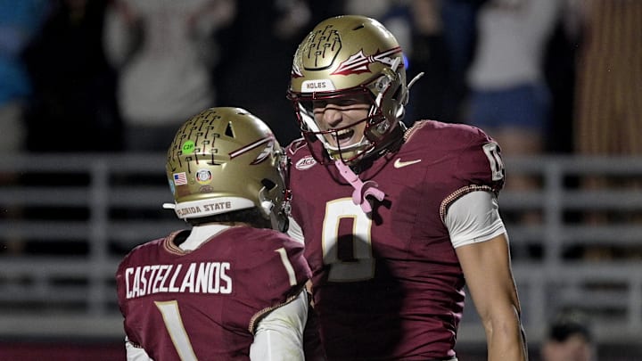 Nov 1, 2025; Tallahassee, Florida, USA; Florida State Seminoles quarterback Tommy Castellanos (1) celebrates a touchdown with wide receiver Duce Robinson (0) during the second half against the Wake Forest Demon Deacons at Doak S. Campbell Stadium. Mandatory Credit: Melina Myers-Imagn Images