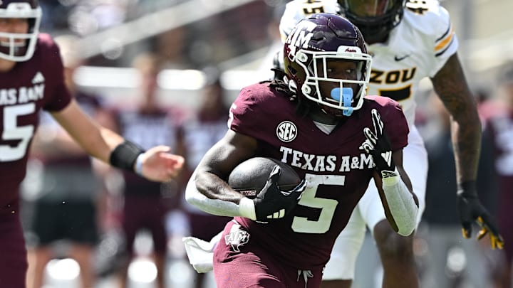 Oct 5, 2024; College Station, Texas, USA; Texas A&M Aggies running back Amari Daniels (5) in the first quarter against the Missouri Tigers at Kyle Field. Mandatory Credit: Maria Lysaker-Imagn Images. 