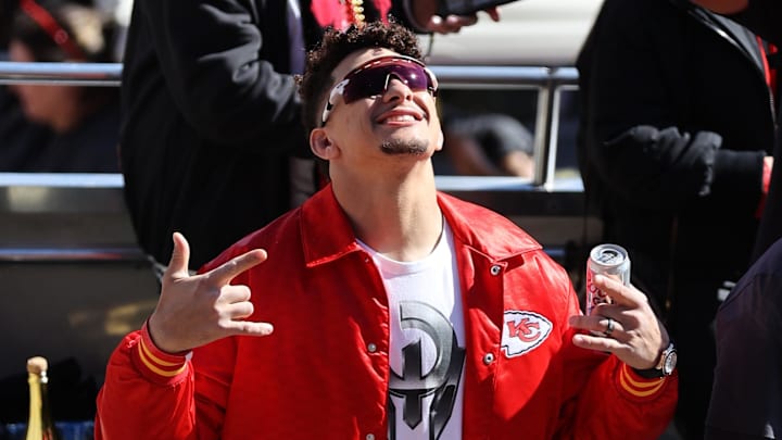 Feb 14, 2024; Kansas City, MO, USA; Kansas City Chiefs quarterback Patrick Mahomes (15) celebrates on the bus in the parade during the celebration of the Kansas City Chiefs winning Super Bowl LVIII. Mandatory Credit: Julia Kapros-USA TODAY Sports