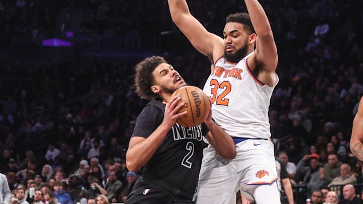 Jan 21, 2025; Brooklyn, New York, USA;  Brooklyn Nets forward Cameron Johnson (2) looks to post up against New York Knicks center Karl-Anthony Towns (32) in the third quarter at Barclays Center. Mandatory Credit: Wendell Cruz-Imagn Images