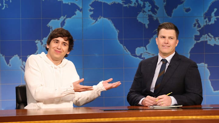 SATURDAY NIGHT LIVE -- Episode 1895 -- Pictured: (l-r) Marcello Hernández and anchor Colin Jost during Weekend Update on Saturday, January 24, 2026 -- (Photo by: Will Heath/NBC)