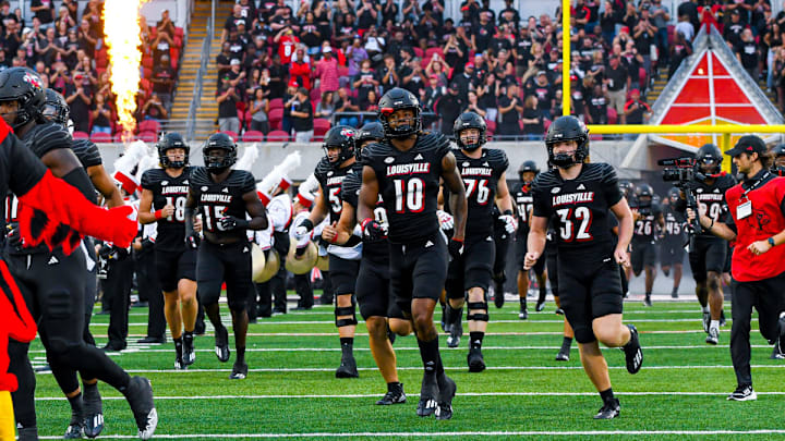 Louisville players running onto the field of L&N Stadium during pregame. Louisville players running onto the field of L&N Stadium during pregame.