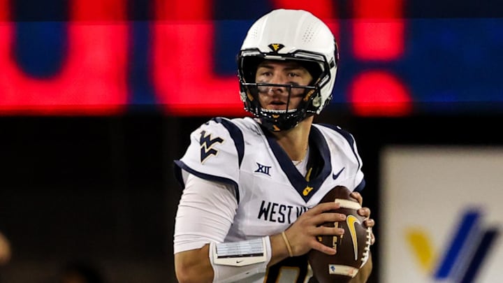 Oct 26, 2024; Tucson, Arizona, USA; West Virginia Mountaineers quarterback Nicco Marchiol (8) looks to throw the ball during the third quarter against the Arizona Wildcats at Arizona Stadium. Mandatory Credit: Aryanna Frank-Imagn Images