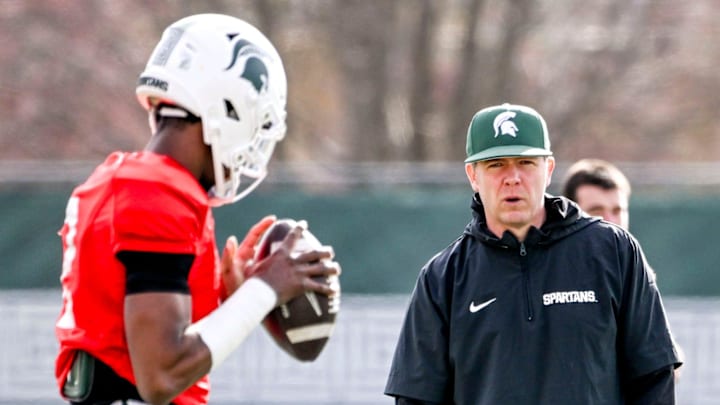 Michigan State quarterbacks coach Jon Boyer, right, talks with MSU quarterback Aidan Chiles during football practice on Tuesday, April 8, 2025, in East Lansing.