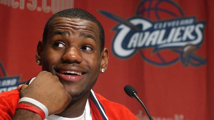 LeBron James answers questions from throng of media members gathered at Gund Arena after he worked out for former Cavaliers head coach Paul Silas and the team on June 20, 2003.