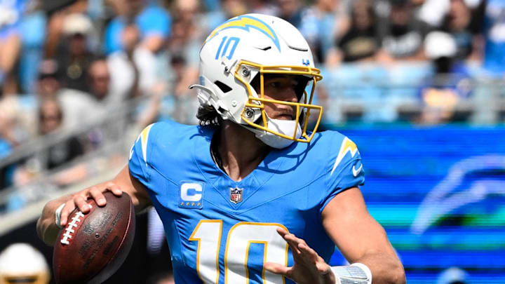 Sep 15, 2024; Charlotte, North Carolina, USA;  Los Angeles Chargers quarterback Justin Herbert (10) looks to pass in the second quarter at Bank of America Stadium. Mandatory Credit: Bob Donnan-Imagn Images