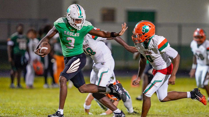 Atlantic wide receiver Mark Hanniford (3) stiff arms a Blanche Ely defender after a third quarter reception in a 41-0 victory over Blanche Ely on Sept. 12, 2025, in Delray Beach, FL.