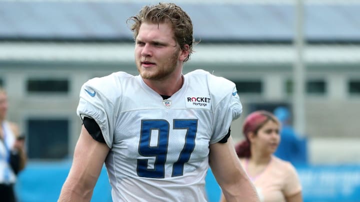 Detroit Lions defensive end Aidan Hutchinson (97) walks off the field after training camp at team headquarters in Allen Park on Friday, July 28, 2023.