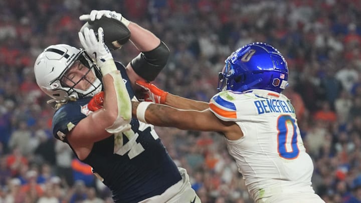 Penn State tight end Tyler Warren catches a touchdown pass over Boise State Broncos safety Ty Benefield in the Fiesta Bowl. Penn State tight end Tyler Warren catches a touchdown pass over Boise State Broncos safety Ty Benefield in the Fiesta Bowl.