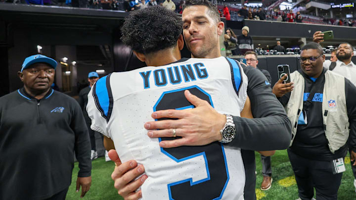 Jan 5, 2025; Atlanta, Georgia, USA; Carolina Panthers head coach Dave Canales celebrates with quarterback Bryce Young (9) after an overtime victory over the Atlanta Falcons at Mercedes-Benz Stadium. 