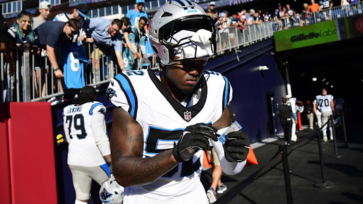 Sep 28, 2025; Foxborough, Massachusetts, USA; Carolina Panthers linebacker DJ Johnson (52) signs an autograph after the game against the New England Patriots at Gillette Stadium. 