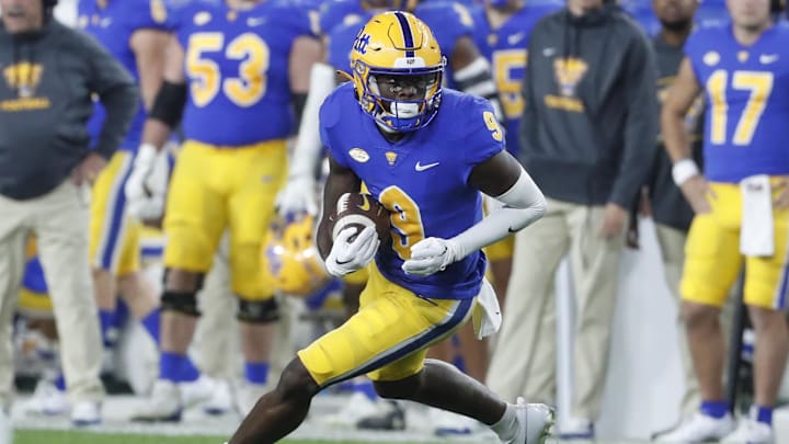 Nov 4, 2023; Pittsburgh, Pennsylvania, USA; Pittsburgh Panthers wide receiver Konata Mumpfield (9) runs after a catch against the Florida State Seminoles during the fourth quarter at Acrisure Stadium. The Seminoles won 24-7. Mandatory Credit: Charles LeClaire-Imagn Images Nov 4, 2023; Pittsburgh, Pennsylvania, USA; Pittsburgh Panthers wide receiver Konata Mumpfield (9) runs after a catch against the Florida State Seminoles during the fourth quarter at Acrisure Stadium. The Seminoles won 24-7. Mandatory Credit: Charles LeClaire-Imagn Images
